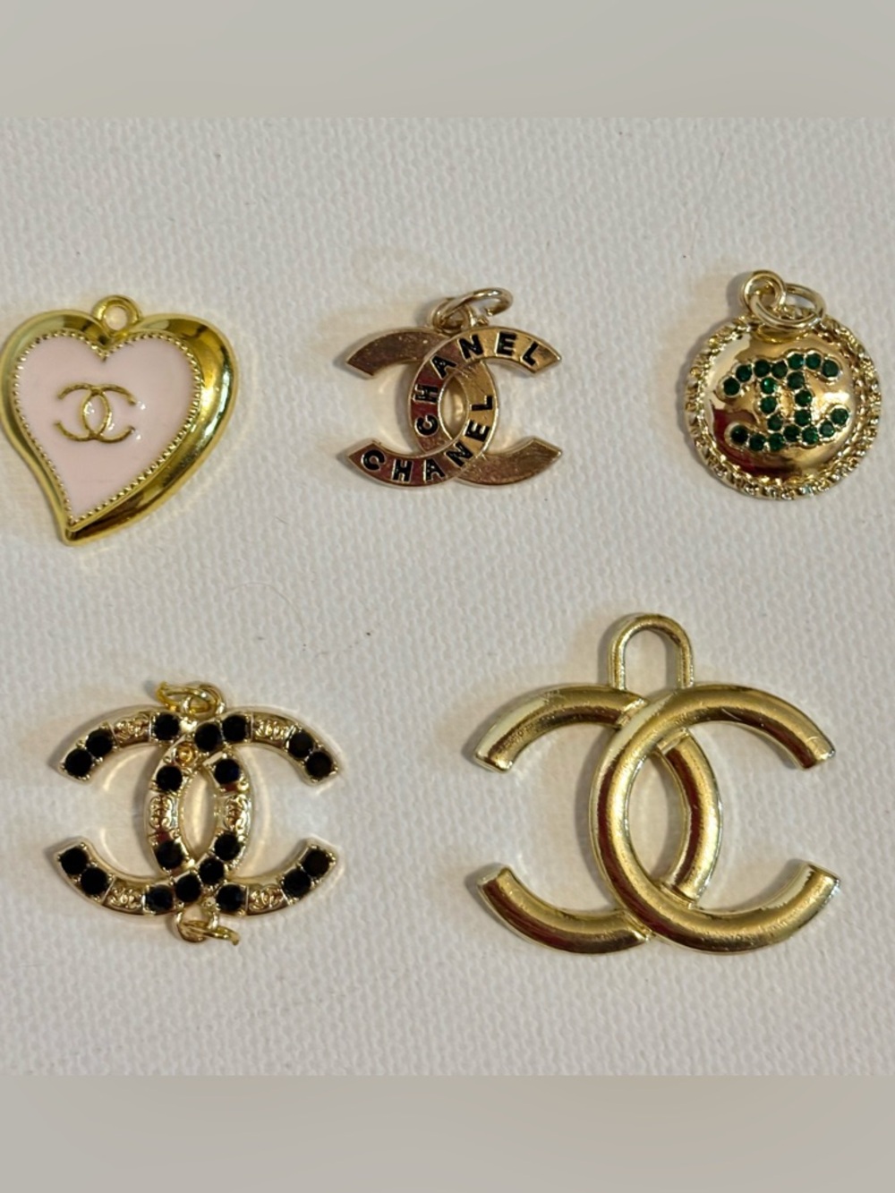 Gold-tone Charms for jewelry, keychains, etc. with assorted accent stones.